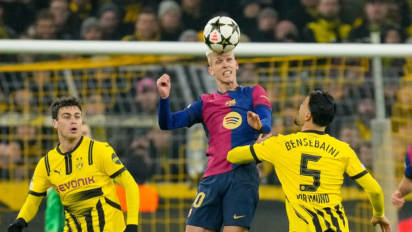 Dani Olmo FC Barcelona and Ramy Bensebaini Borussia Dortmund battle for the ball during the UEFA Champions League 2024 25 League Phase MD6 match between Borussia Dortmund and FC Barcelona at Signal Iduna Park on December 11, 2024
