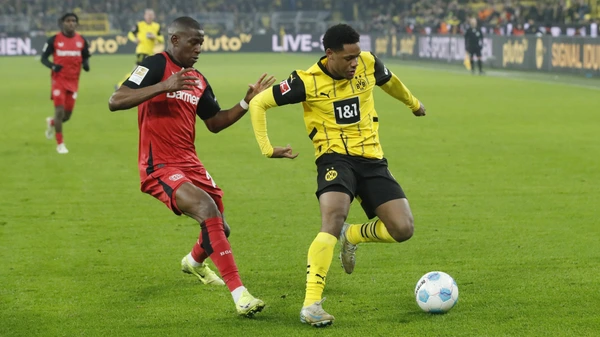 Nordi Mukiele of Bayer 04 Leverkusen, Julien Duranville of Borussia Dortmund during the Bundesliga match between Borussia Dortmund and Bayer Leverkusen at Signal Iduna Park on Jan. 10, 2025