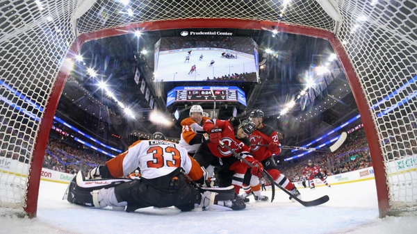 Nico Hischier #13 of the New Jersey Devils skates in his 500th NHL game against Samuel Ersson #33 of the Philadelphia Flyers at Prudential Center on January 18, 2025 in Newark, New Jersey. The Flyers defeated the Devils 3-1.