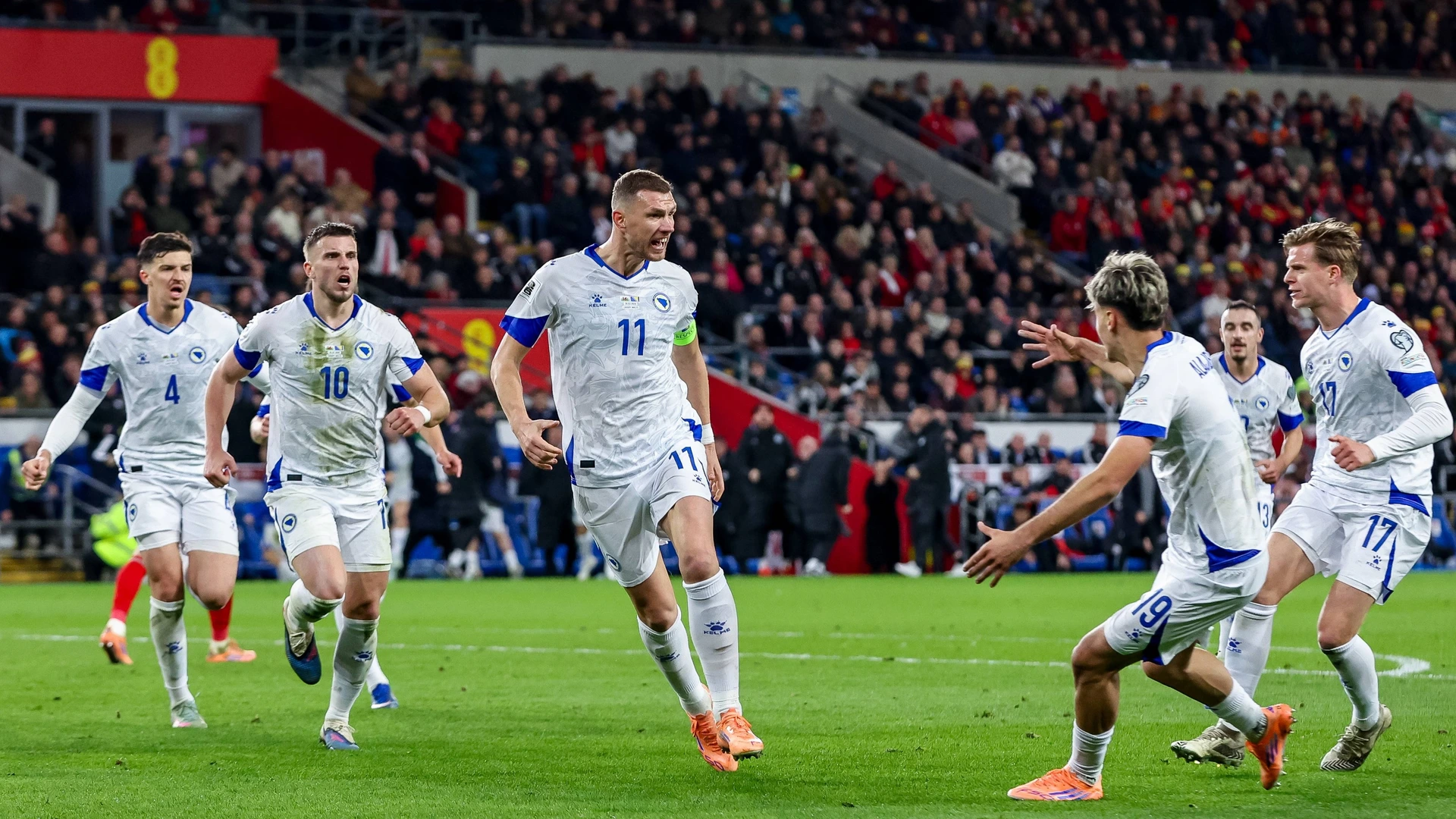 Bosnia and Herzegovina players celebrate a goal by Edin Dzeko during the FIFA World Cup Play-offs Semi-final match between Wales and Bosnia and Herzegovina at the Cardiff City Stadium in Cardiff, United Kingdom, on March 26, 2026. 
