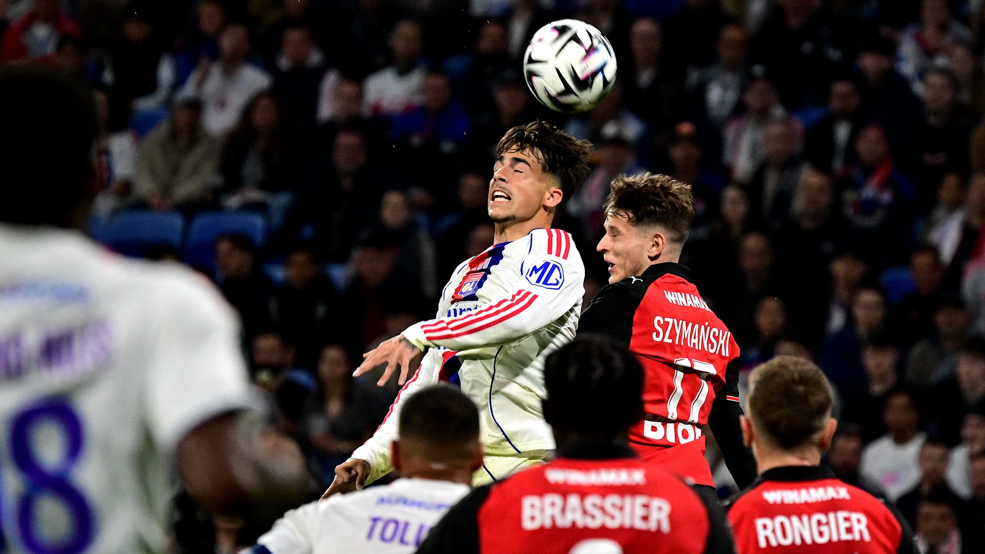 Lyon's Portuguese forward #17 Afonso Moreira (top L) fights for the ball with Rennes' Polish midfielder #17 Sebastian Szymanski (top R) during thematch between Olympique Lyonnais on May 3, 2026.
