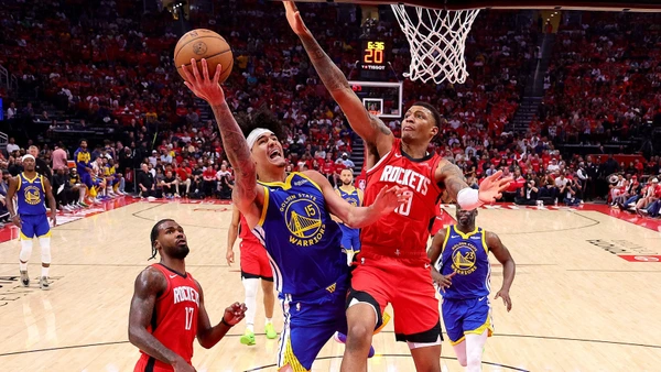 Gui Santos #15 of the Golden State Warriors attempts a shot against Jabari Smith Jr. #10 of the Houston Rockets in Game One of the Western Conference First Round NBA Playoffs at Toyota Center on April 20, 2025 in Houston, Texas.
