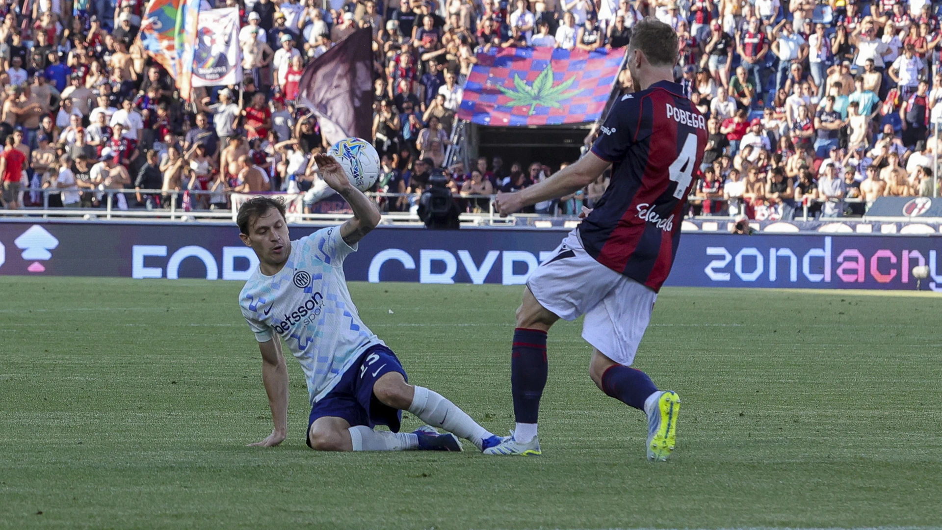 Nicolo Barella of Inter FC competes for the ball with Tommaso Pobega of Bologna FC during the Bologna FC vs FC Inter, 38th Serie A Enilive 2025-26 game at Renato Dall'Ara Stadium in Bologna, Italy, on May 23, 2026.