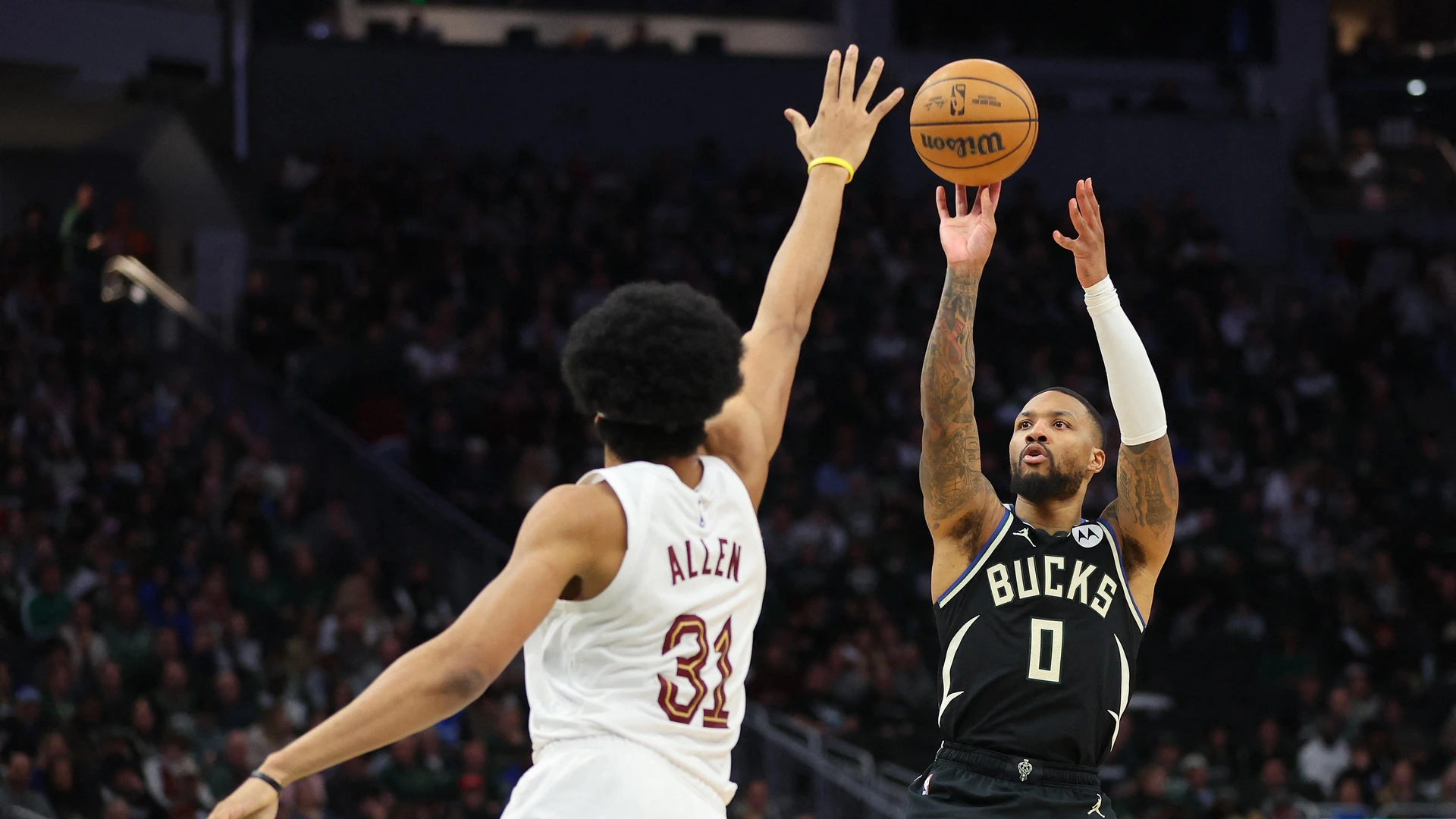 Damian Lillard #0 of the Milwaukee Bucks is defended by Jarrett Allen #31 of the Cleveland Cavaliers during an NBA  game at Fiserv Forum on January 26, 2024 in Milwaukee, Wisconsin.