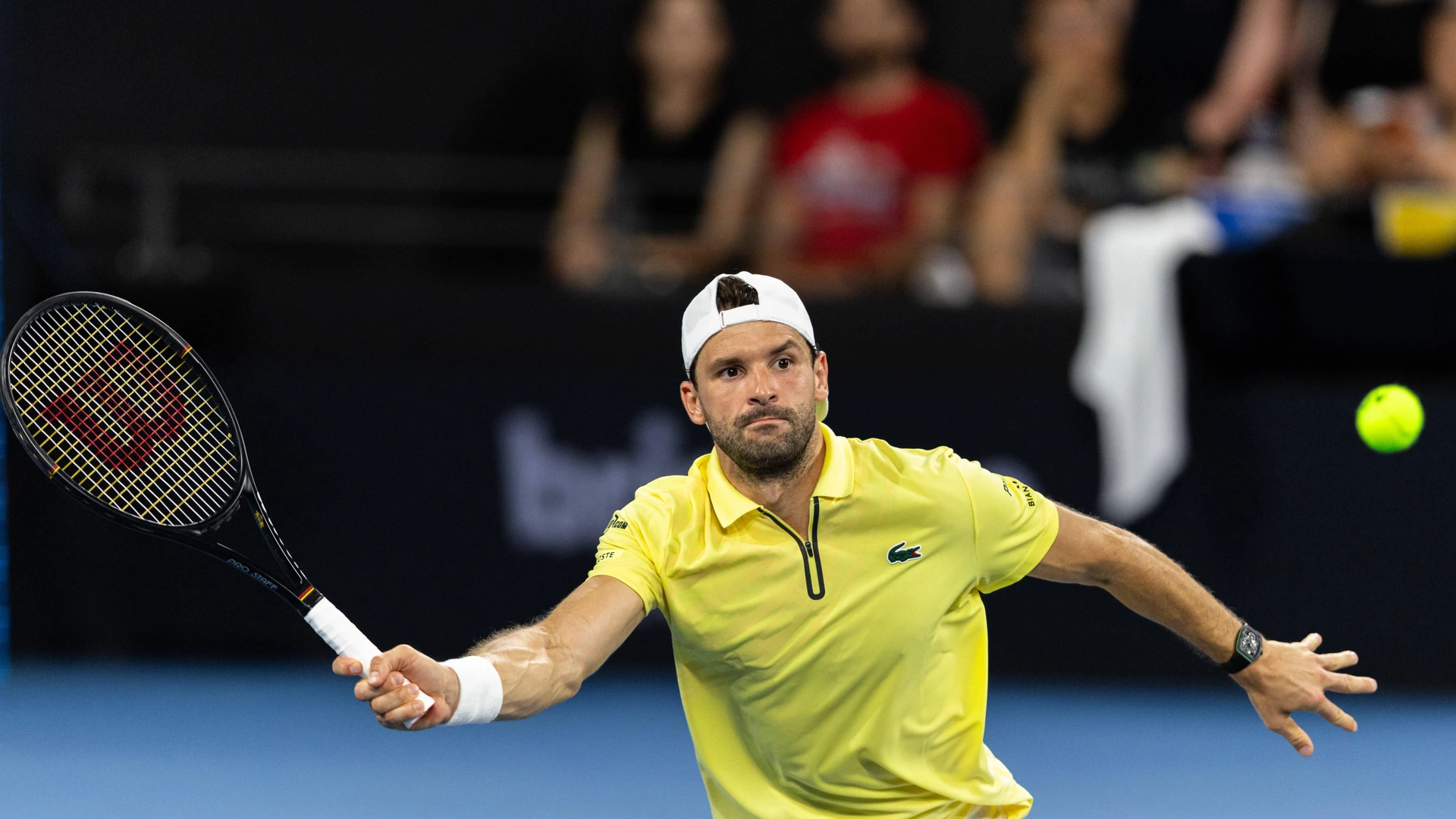 GRIGOR DIMITROV of Bulgaria plays a forehand volley during his match against RAPHAEL COLLIGNON of Belgium at the Brisbane International. Brisbane Australia