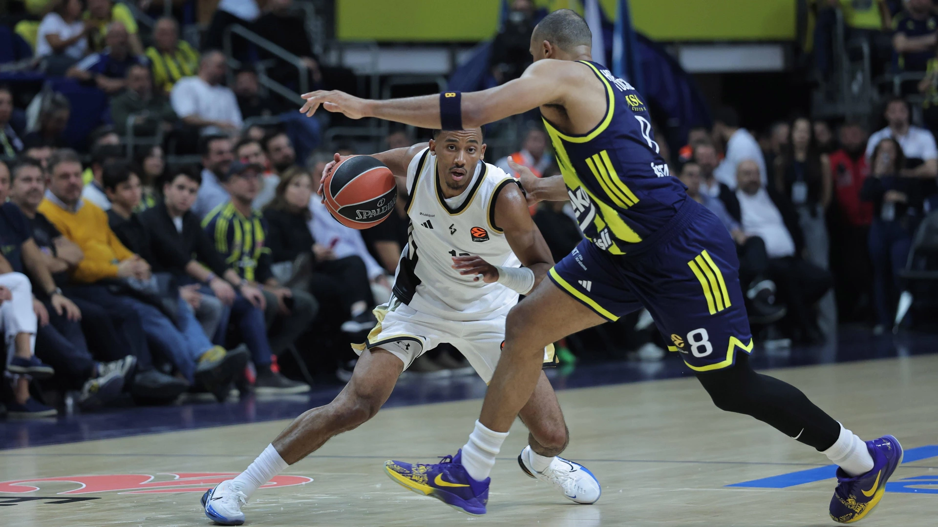 ISTANBUL, TURKEY - November 06 : Talen Horton Tucker 8 of Fenerbahce Beko and Mehdy Ngouama L of Asvel Lyon in action during the EuroLeague Regular Season match between Fenerbahce Beko Istanbul and Asvel Lyon at Ulker Sports Arena on November 06, 2025