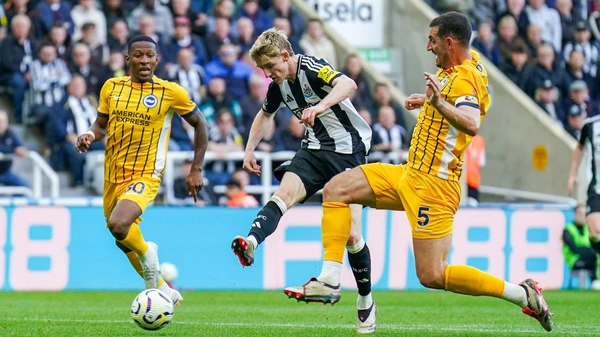 Newcastle United midfielder Anthony Gordon 10 shoots at goal from Brighton & Hove Albion defender Lewis Dunk 5 tackle during the Newcastle United FC v Brighton & Hove Albion FC English Premier League match on 19 October 2024