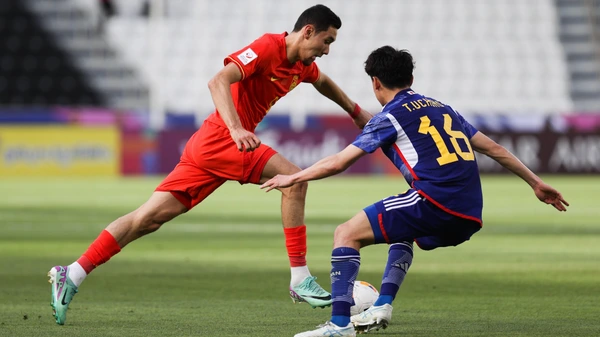 Behram Abduweli 9 of China and Takashi Uchino 16 of Japan compete for the ball during the AFC U23 Asian Cup 2024 Group B match between China and Japan at the Jassim Bin Hamad Stadium on April 16, 2024 in Doha