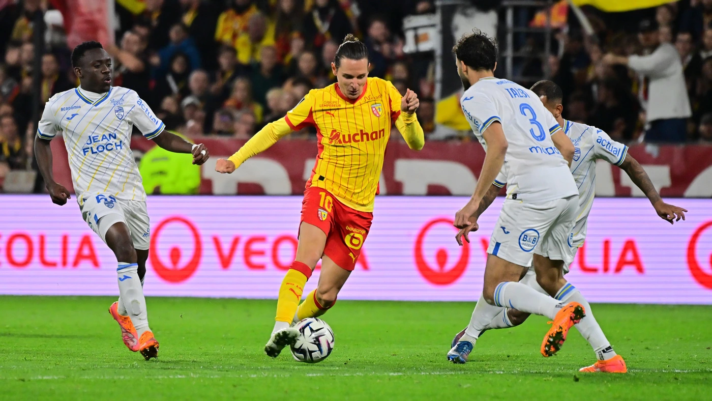 Lens vs Lorient - Ligue 1 - 02/11/2025 Florian Thauvin 10 - Lens and Montassar TALBI 3 - FC Lorient during the Ligue 1 match between RC Lens and FC Lorient at Stade Felix Bollaert on November 02, 2025 in Lens, France.