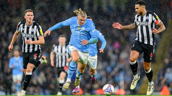 Erling Haaland of Manchester City and Jamaal Lascelles of Newcastle during the English FA Cup, quarter final football match between Manchester City and Newcastle United on 16 March 2024 at the Etihad Stadium in Manchester, England