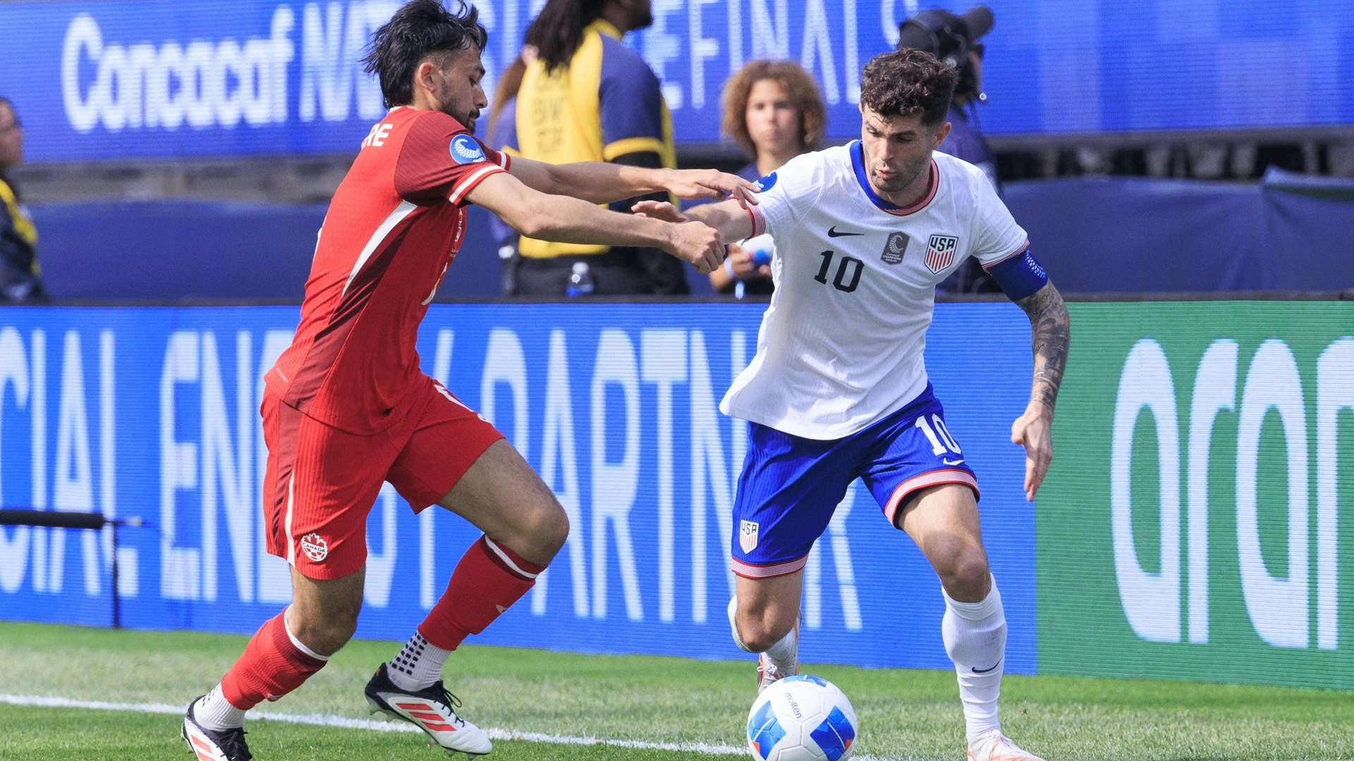 Christian Pulisic 10 of United States national team, Nationalteam takes possession of the ball as Mathieu Choiniere 6 of Canada defends during the CONCACAF Nations League Cup 3rd Place game on Sunday March 23, 2025