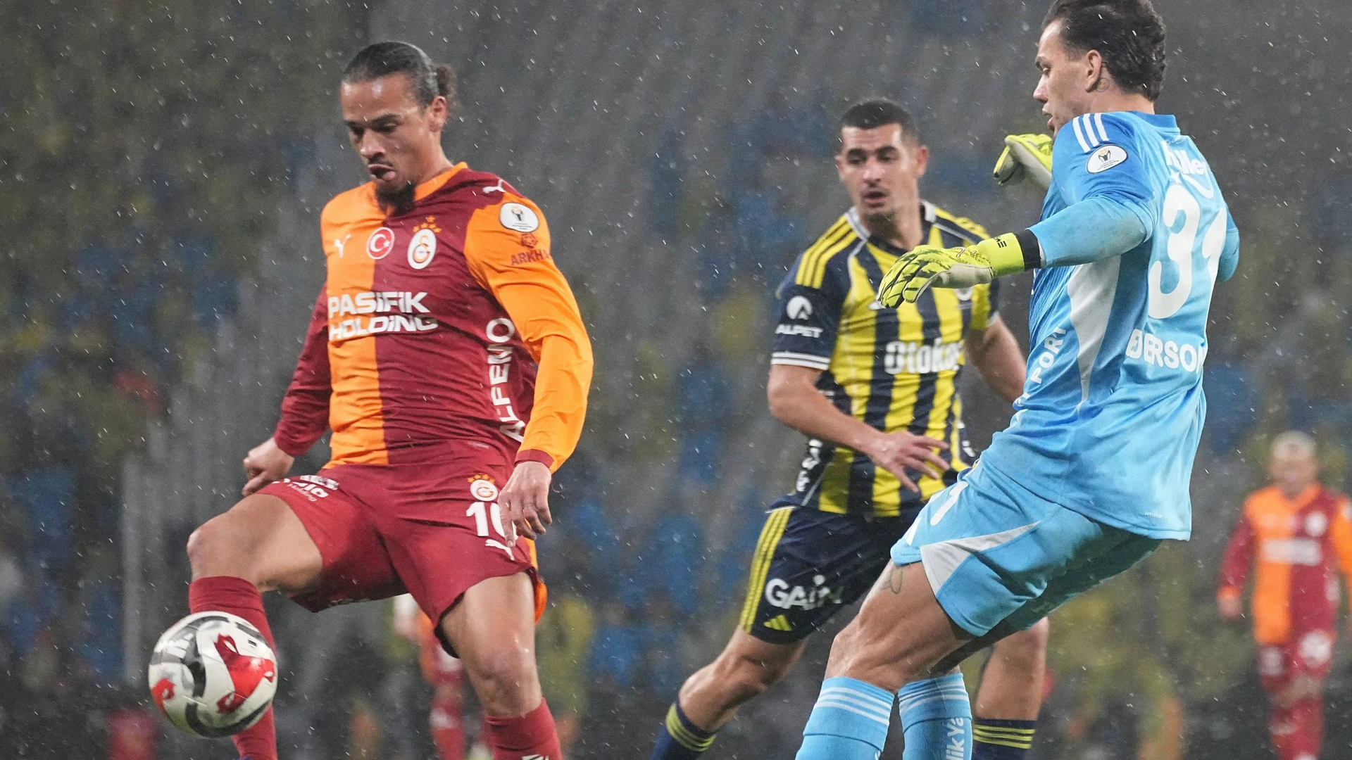 Goalkeeper Ederson of Fenerbahce SK and Leroy Sane of Galatasaray SK battle for the ball during the Turkish Super Cup Final match between Fenerbahce SK and Galatasaray SK at Ataturk Olympic Stadium on January 10, 2026