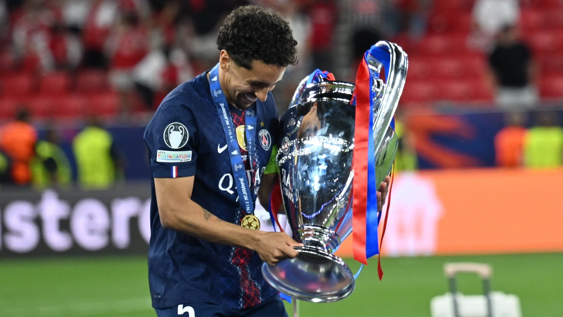 PSG retain UEFA Champions League title after penalty shootout win over Arsenal BUDAPEST, HUNGARY - MAY 30: Marquinhos of Paris Saint-Germain lifts the trophy after winning the UEFA Champions Leagu