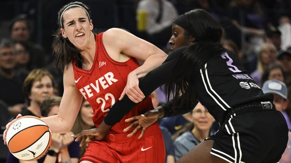 SAN FRANCISCO, CALIFORNIA - JUNE 19: Caitlin Clark #22 of the Indiana Fever dribbles against Laeticia Amihere #3 of the Golden State Valkyries in the first quarter at Chase Center on June 19, 2025 in San Francisco, California.