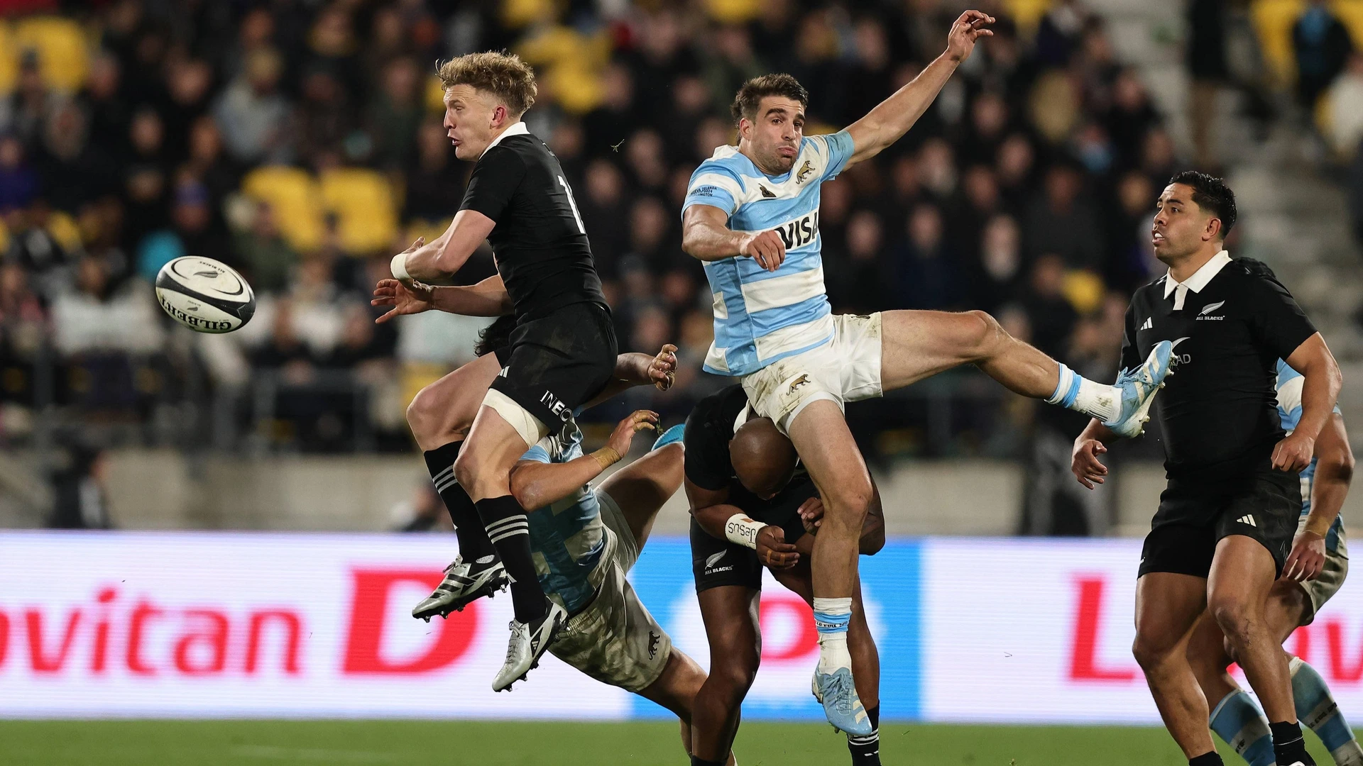Damian McKenzie of New Zealand and Juan Cruz Mallia of Argentina during the Lipovitan-D Rugby Championship 2024 first test between New Zealand and Argentina at Sky Stadium in Wellington, New Zealand on Saturday August 10, 2024.