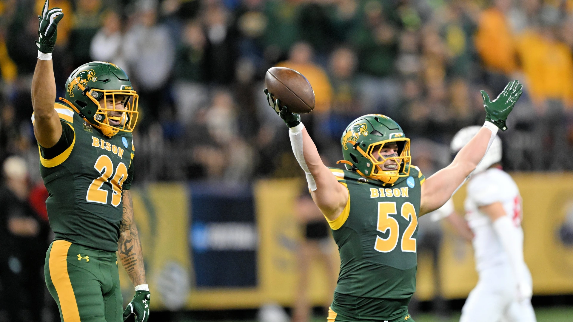 North Dakota State Bison linebacker Nathaniel Staehling 52 and North Dakota State Bison safety Darius Givance 29 celebrate an interception during a NCAA, College League, USA FCS second round playoff football game between the Illinois State Redbirds and the North Dakota State Bison at the Fargodome in Fargo, ND on Saturday, December 6, 2025.