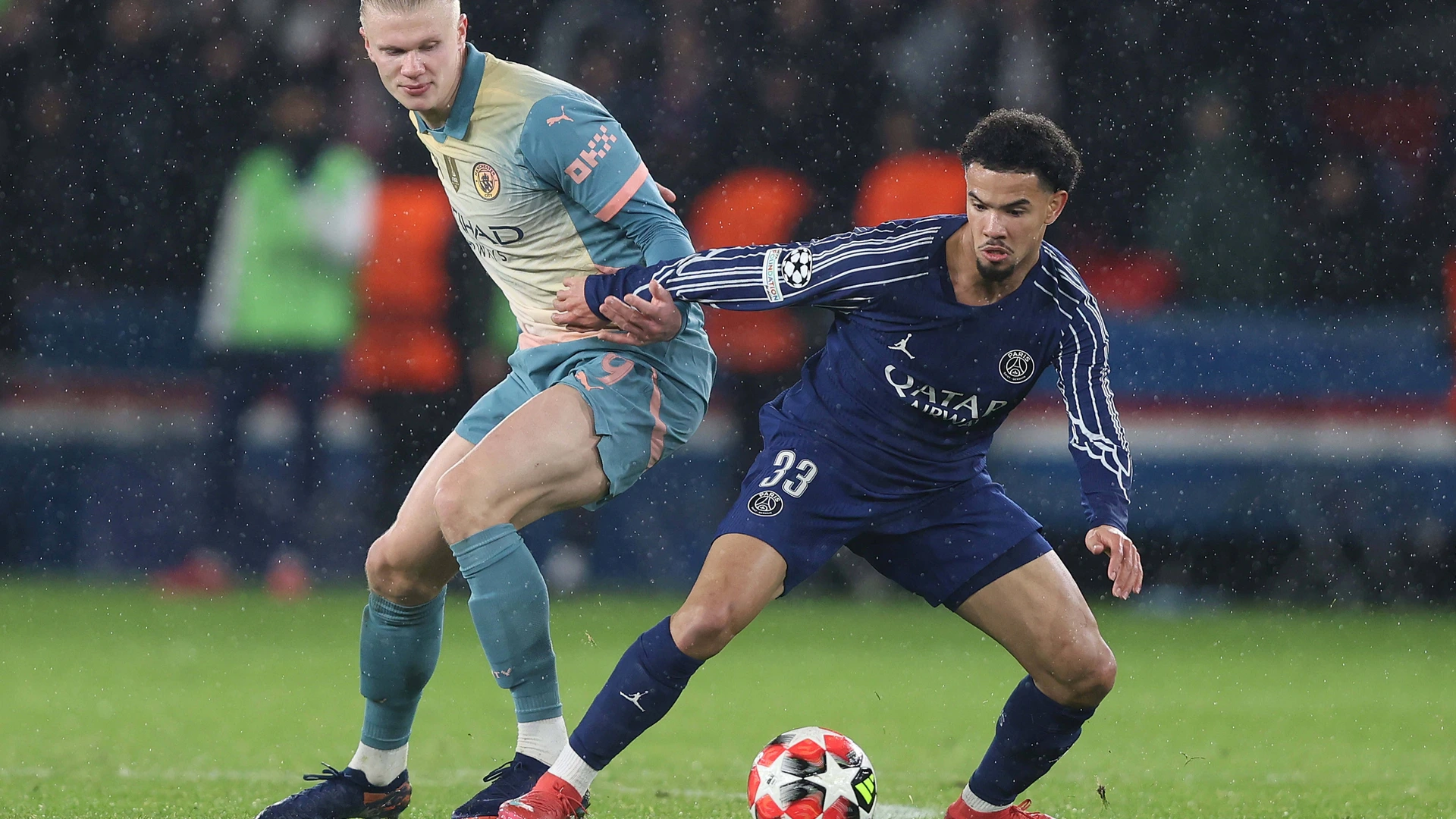  Erling Haaland of Manchester City battles Warren Zaire-Emery of Paris Saint-Germain. - Paris Saint-Germain v Manchester City, UEFA Champions League, League Stage, MD7, Parc des Princes Stadium, Paris, France - 22nd January 2025.
