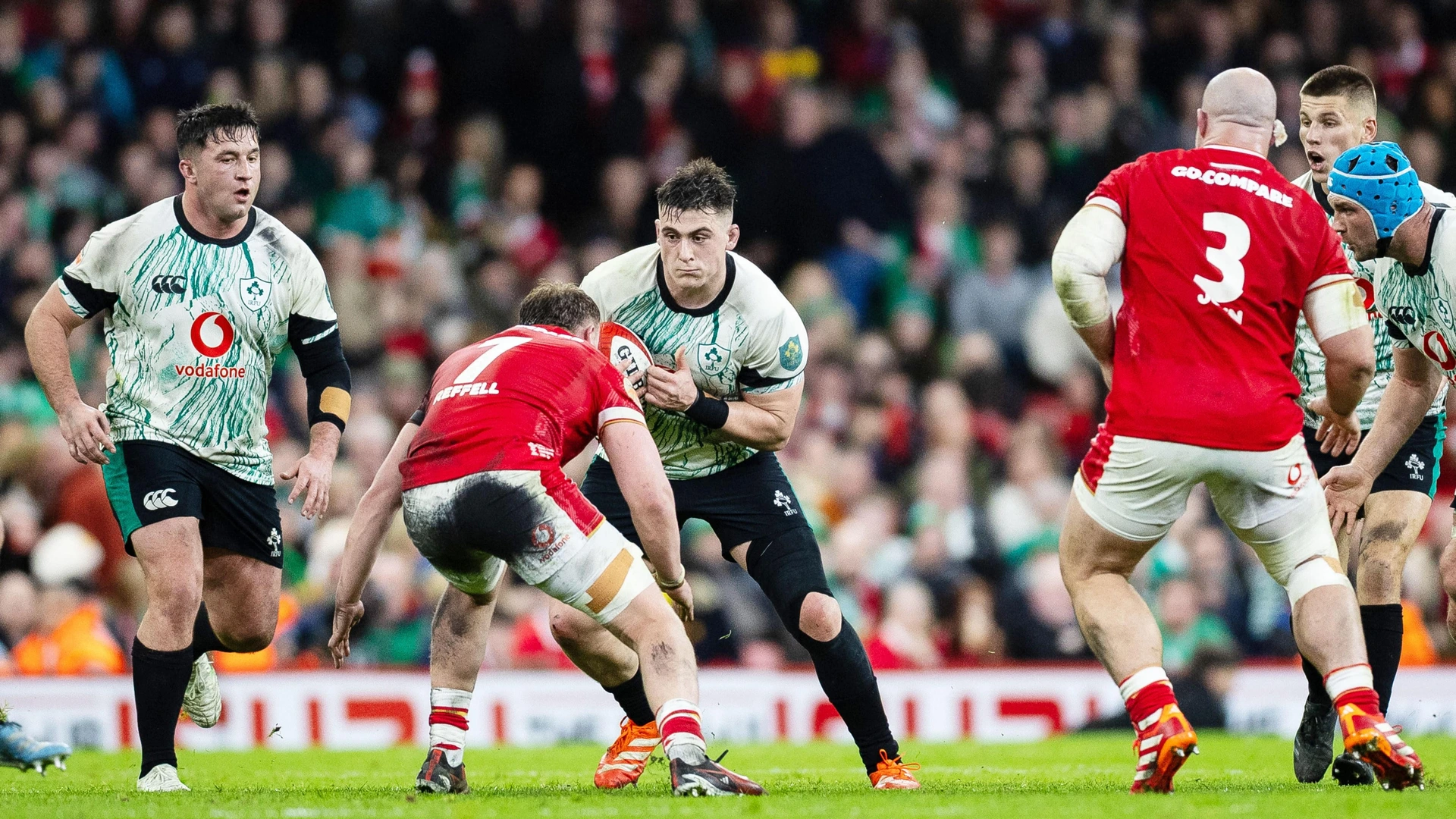 Dan Sheehan of Ireland under pressure from Nicky Smith of Wales during the 2025 Six Nations Championship, rugby union match between Wales and Ireland on 22 February 2025 at Principality Stadium in Cardiff, Wales.