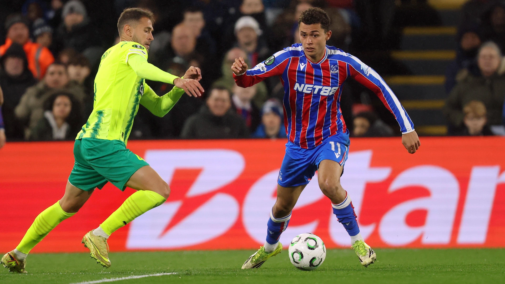Evann Guessand of Crystal Palace battles for the ball with Marcus Rohden of AEK Larnaca FC . - Crystal Palace FC v AEK Larnaca FC, UEFA Conference League 2025-26, Round Of 16, 1st Leg, Selhurst Park Stadium, London, UK - 12th March 2026.