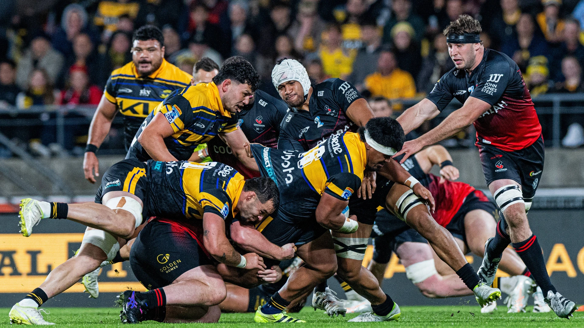 May 1, 2026: Super Rugby Pacific 2026 Round 12: Hurricanes player Raymond Tuputupu 16 right attempts to force his way through the Crusaders defence despite the best efforts of several Crusaders players during the Super Rugby Pacific Round 12 fixture between the Hurricanes and Crusaders at the Hnry Stadium on Friday in Wellington.