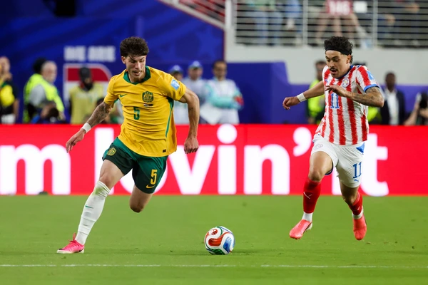 June 25, 2026, Santa Clara, California, USA: Santa Clara, USA - June 25 2026: Jordan Bos 5 of Australia and MauroÂ­cio 11 of Paraguay run during a FIFA World Cup, WM, Weltmeisterschaft, Fussball gr...
