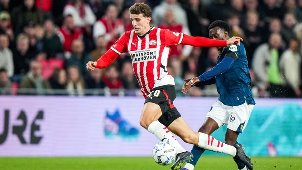 Sparta Rotterdam's Surinamese defender #05 Djevencio van der Kust (R) tackles PSV Eindhoven's Dutch midfielder #20 Guus Til during the Dutch Eredivisie match between PSV Eindhoven and Sparta Rotterdam at Philips Stadium in Eindhoven on October 5, 2024.