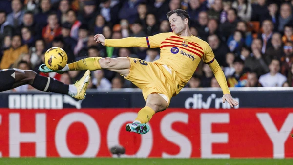 La Liga EA Sports Robert Lewandowski of FC Barcelona, Barca is attempting a kick to score a goal during the match between Valencia CF and FC Barcelona at Estadio de Mestalla in Valencia, Spain, on December 16, 2023.