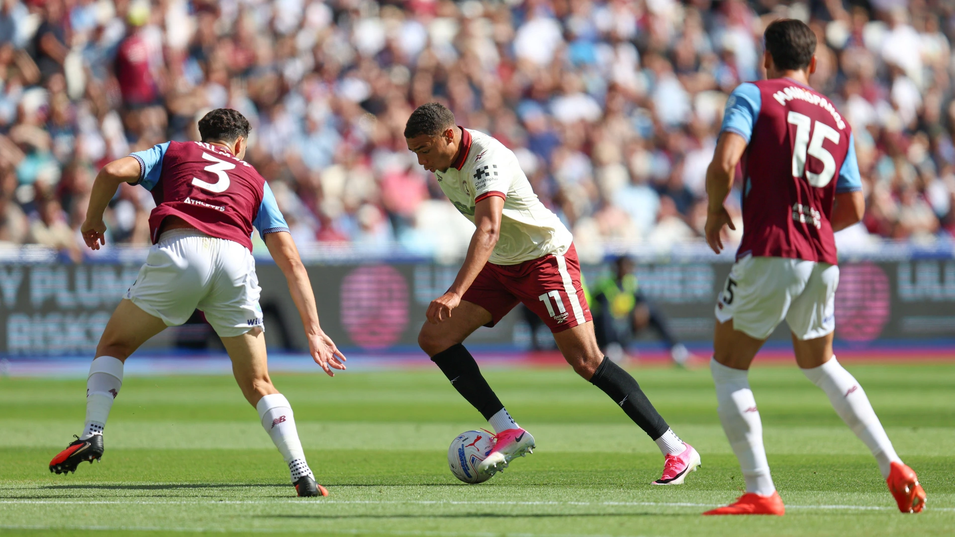 Miles Leaburn of Charlton Athletic receives pressure from Maximilian Kilman of West Ham United and Konstantinos Mavropanos of West Ham United during the Championship match between West Ham and Charlton at London Stadium on August 22nd, 2026