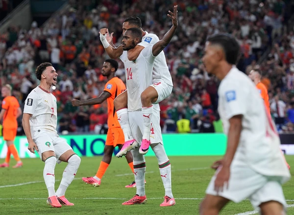 (260630) -- MONTERREY, June 30, 2026 -- Issa Diop (C, down) of Morocco celebrates with his teammates after scoring during the round of 32 match between the Netherlands and Morocco at the 2026 FIFA ...