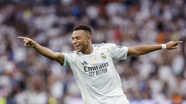 Real Madrid's French forward #10 Kylian Mbappe celebrates after scoring their second goal during the Spanish league football match between Real Madrid CF and RCD Espanyol at the Santiago Bernabeu stadium in Madrid on September 20, 2025.