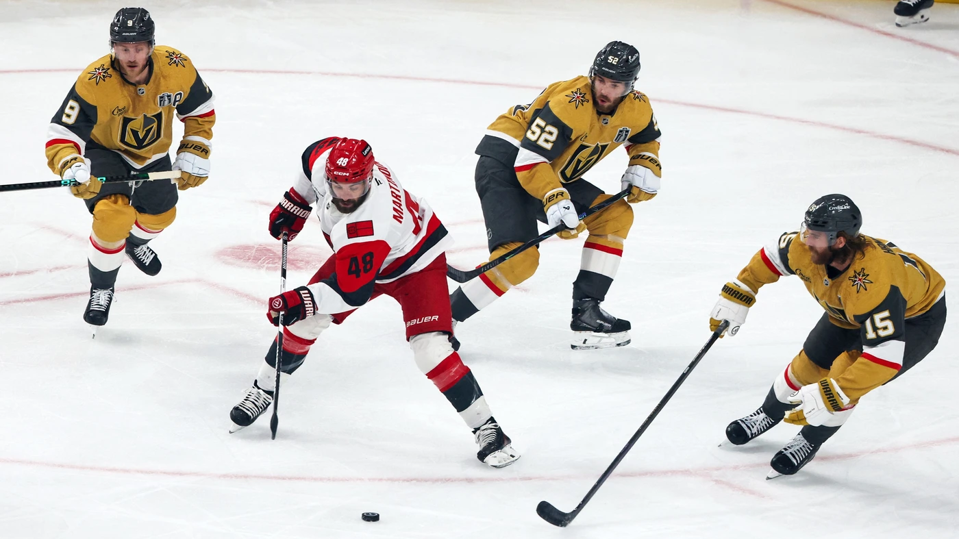 LAS VEGAS, NEVADA - JUNE 09: Jordan Martinook #48 of the Carolina Hurricanes skates with the puck against Jack Eichel #9, Dylan Coghlan #52 and Noah Hanifin #15 of the Vegas Golden Knights in the first period of Game Four of the 2026 NHL Stanley Cup Final at T-Mobile Arena on June 09, 2026 in Las Vegas, Nevada. The Hurricanes defeated the Golden Knights 5-3.