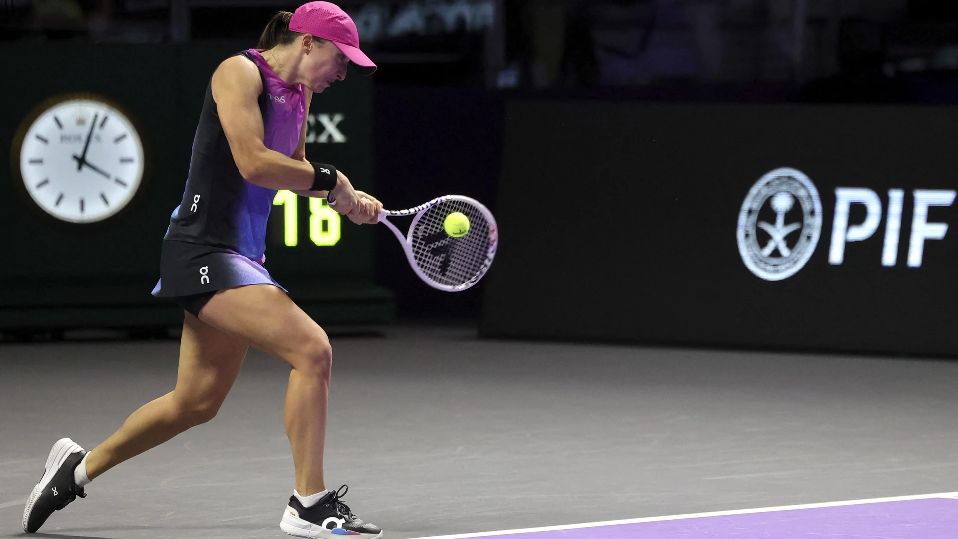 Poland's Iga Swiatek hits a return against Czech Republic's Barbora Krejcikova during their women's singles tennis match at the WTA Finals Championship in Riyadh on November 3, 2024