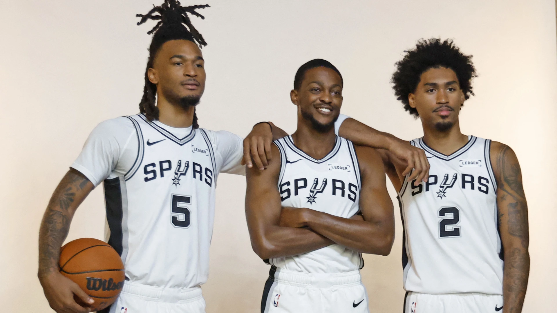 Stephon Castle #5, De'Aaron Fox 34 and Dylan Harper #2 of the San Antonio Spurs pose for photos during San Antonio Spurs Media Day at Victory Capital Performance Center on September 28, 2026 in San Antonio, Texas.