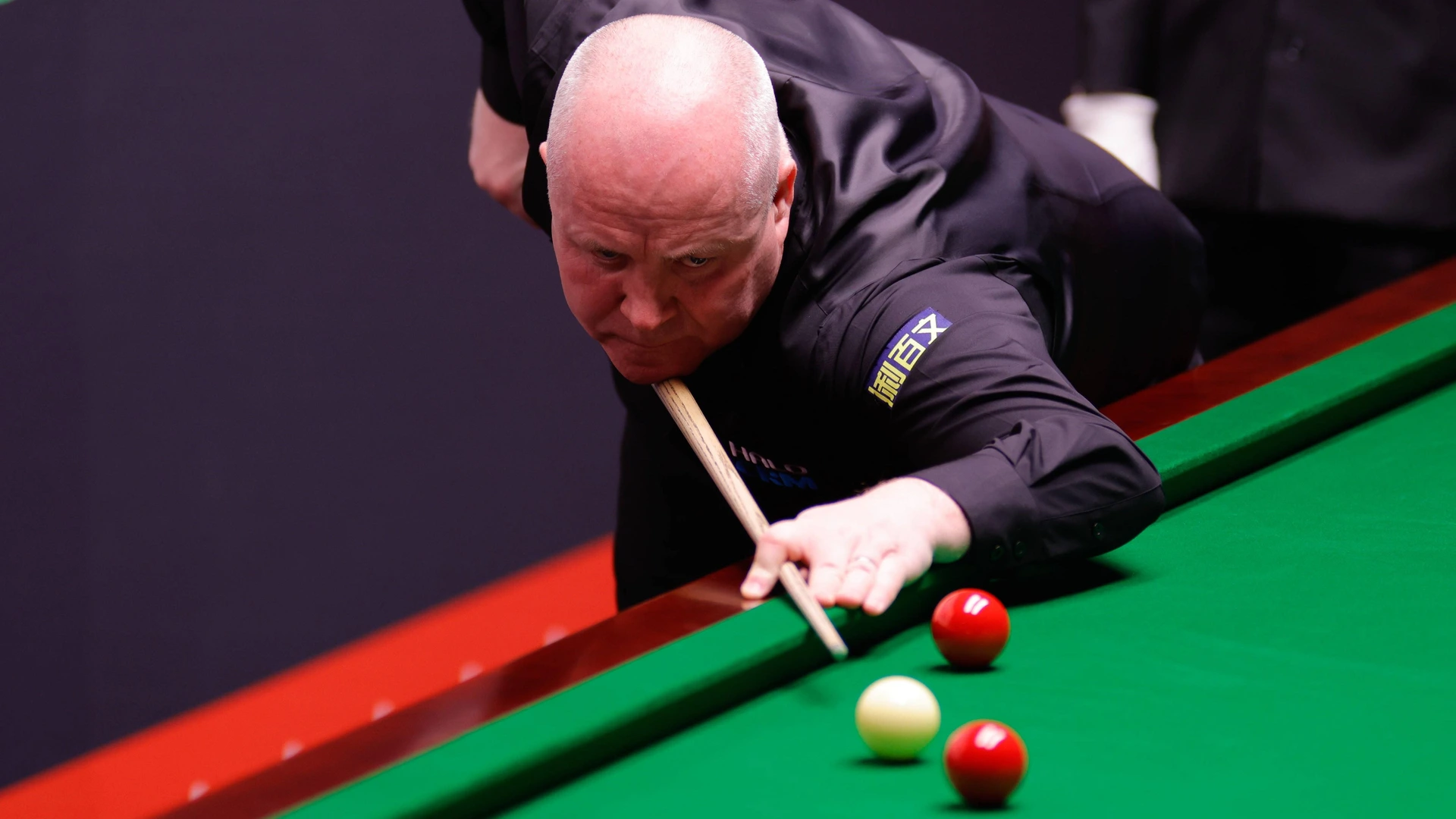 SHEFFIELD, ENGLAND - APRIL 28: John Higgins of Scotland plays a shot in the Quarterfinal match against Neil Robertson of Australia on day 11 of Halo World Championship, 2026 at Crucible Theatre on April 28, 2026 in Sheffield, England.