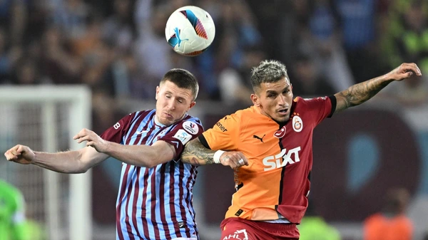 Dries Mertens (R) of Galatasaray in action against John Lundstram (L) of Trabzonspor during Turkish Super Lig week 35 football match between Trabzonspor and Galatasaray at Papara Park in Trabzon, Turkiye on May 10, 2025.