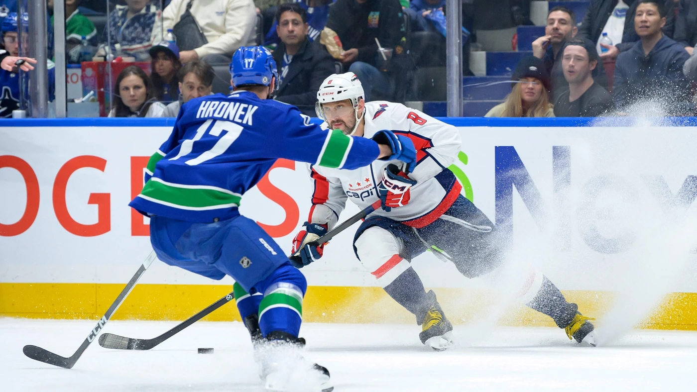 Filip Hronek #17 of the Vancouver Canucks defends against Alex Ovechkin #8 of the Washington Capitals during the third period of their NHL game at Rogers Arena on March 16, 2024 in Vancouver, British Columbia, Canada.
