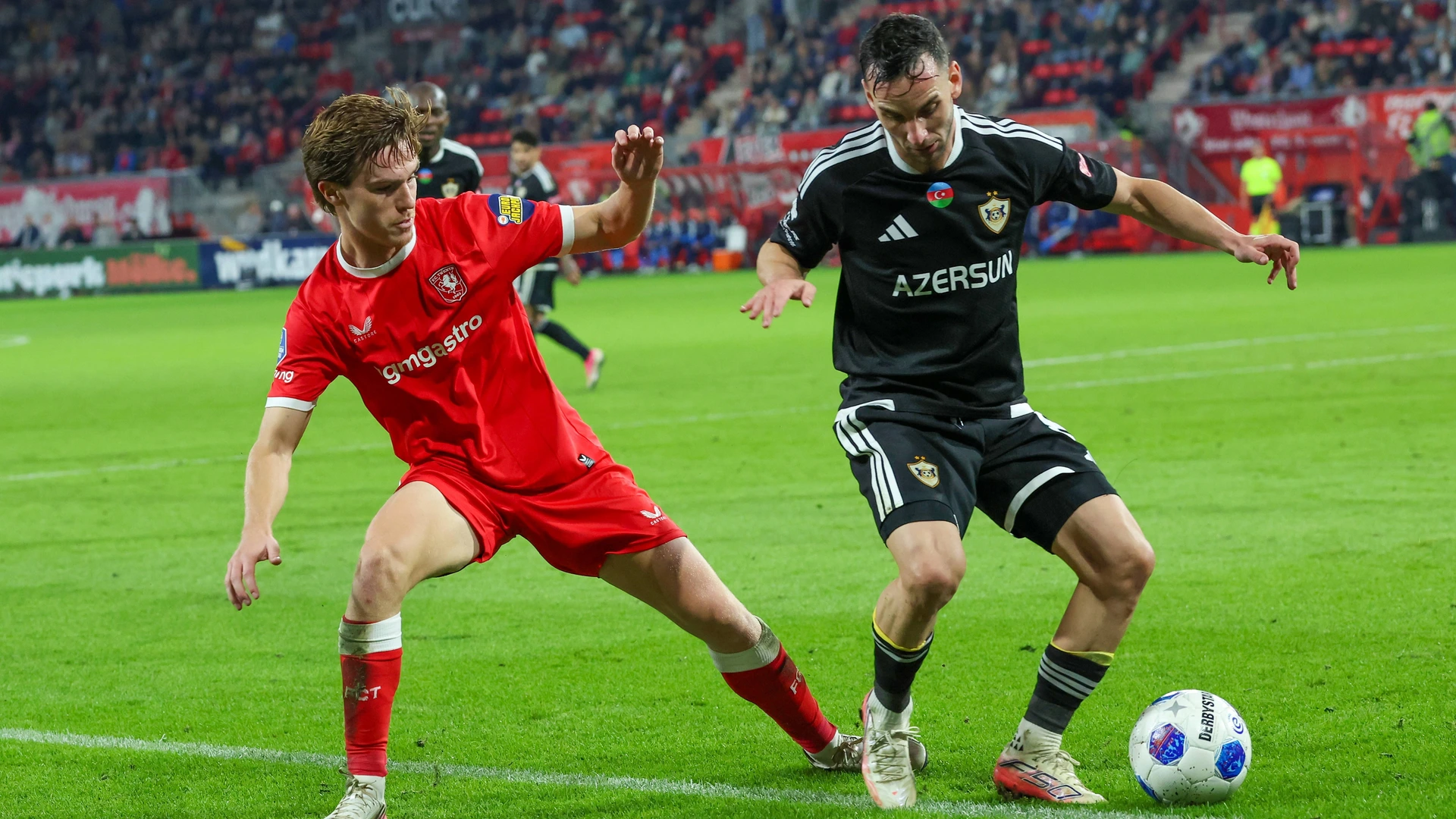 Twente forward Daan Rots and FK Qarabag midfielder Marko Jankovic during the UEFA Conference League match between FC Twente and FK Qarabag at Golsch Veste on August 20, 2026