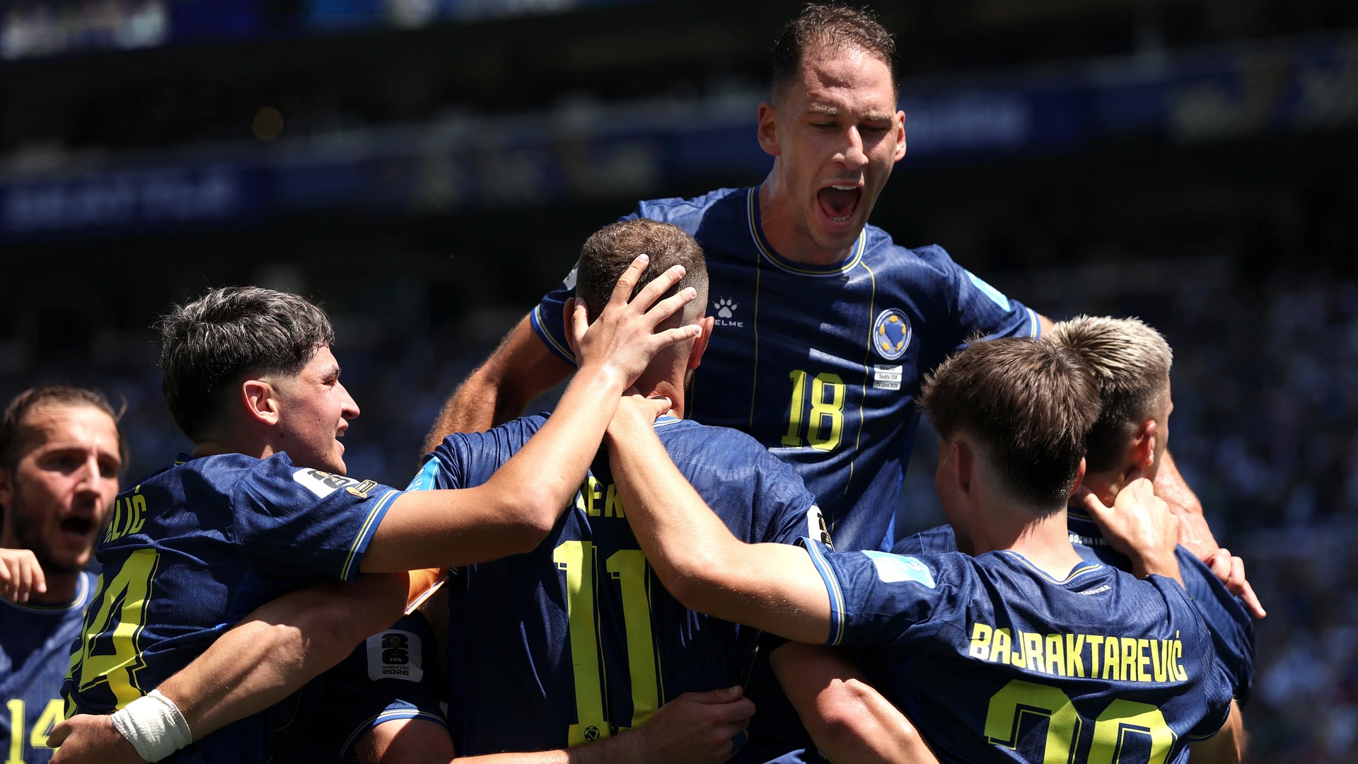 Bosnia and Herzegovina players including Edin Dzeko (11) and Nikola Katic (18)celebrate after an own goal by Sultan Albrake #18 of Qatar for the team’s second goal during the FIFA World Cup 2026 match between Bosnia and Herzegovina and Qatar at Seattle Stadium on June 24, 2026