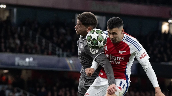 Gabriel Martinelli of Arsenal jumps for the ball with Federico Valverde of Real Madrid during the UEFA Champions League 2024/25 Quarter Final First Leg match between Arsenal FC and Real Madrid C.F. at Emirates Stadium on April 08, 2025