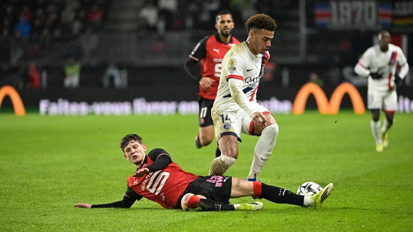 Rennes' Polish midfielder #17 Sebastian Szymanski (L) and Paris Saint-Germain's French midfielder #14 Desire Doue fight for the ball during the French L1 football match between Stade Rennais FC and Paris Saint-Germain (PSG)  February 13, 2026