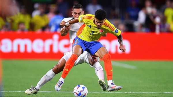 Luis Diaz L of Colombia fights for the ball with Sebastian Caceres R of Uruguay during the CONMEBOL Copa America 2024 Semi-final on July 10, 2024