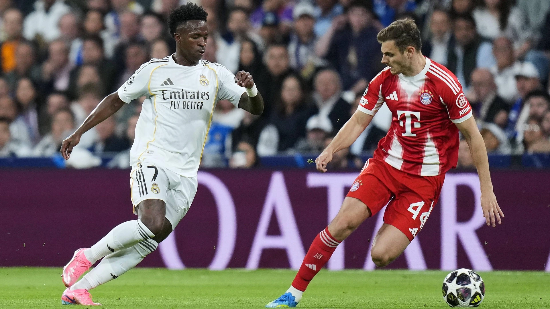 Vinicius Junior of Real Madrid CF and Josip Stanisic of FC Bayern Munchen during the UEFA Champions League match, between Real Madrid and Bayern Munich, Quarter-Finals, first leg, played at Santiago Bernabeu Stadium on April 7, 2026