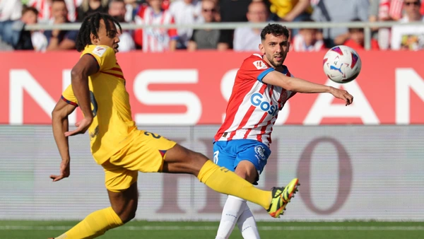 MADRID, SPAIN - JANUARY 28: Marcos Llorente of Atletico de Madrid competes with Cenk Ozkacar of Valencia during the La Liga match between Atletico de Madrid and Valencia CF played at Civitas Metropolitano Stadium on January 28 in Madrid, Spain.