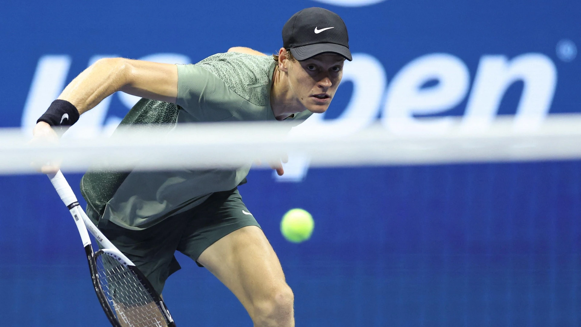 Italy's Jannik Sinner eyes the ball during the men's quarterfinals match against Russia's Daniil Medvedev (L) on day ten of the US Open tennis tournament at the USTA Billie Jean King National Tennis Center in New York City, on September 4, 2024.