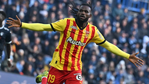 Lens’ French defender #19 Goduine Koyalipou celebrates after scoring his team's first goal during the French L1 football match between Le Havre AC and RC Lens at The Stade Oceane in Le Havre, north-western France, on January 12, 2025.