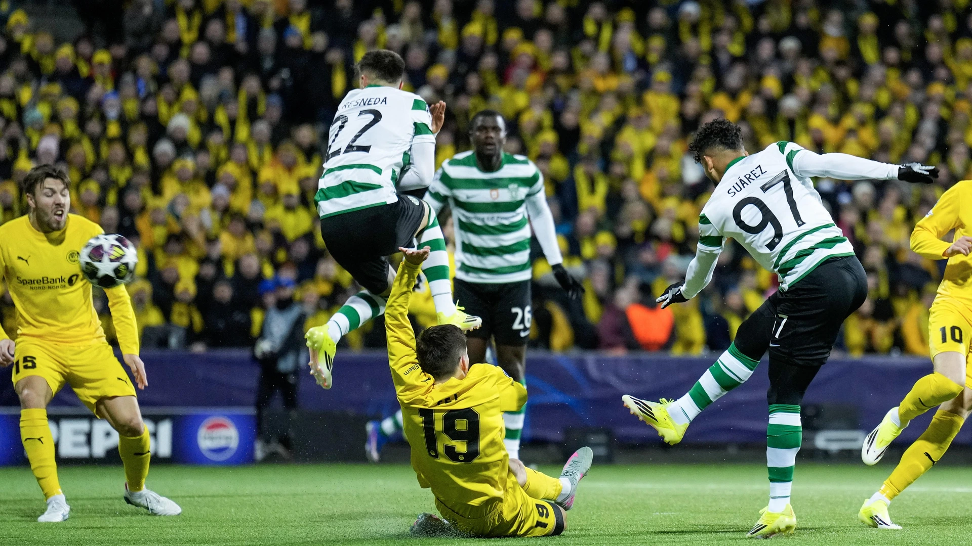 Sporting Lisbon's Colombian forward #97 Luis Suarez (R) shoots during the UEFA Champions League, Last 16, first-leg football match Bodo/Glimt vs Sporting CP at the Aspmyra stadium, in Bodo, Norway on March 11, 2026.