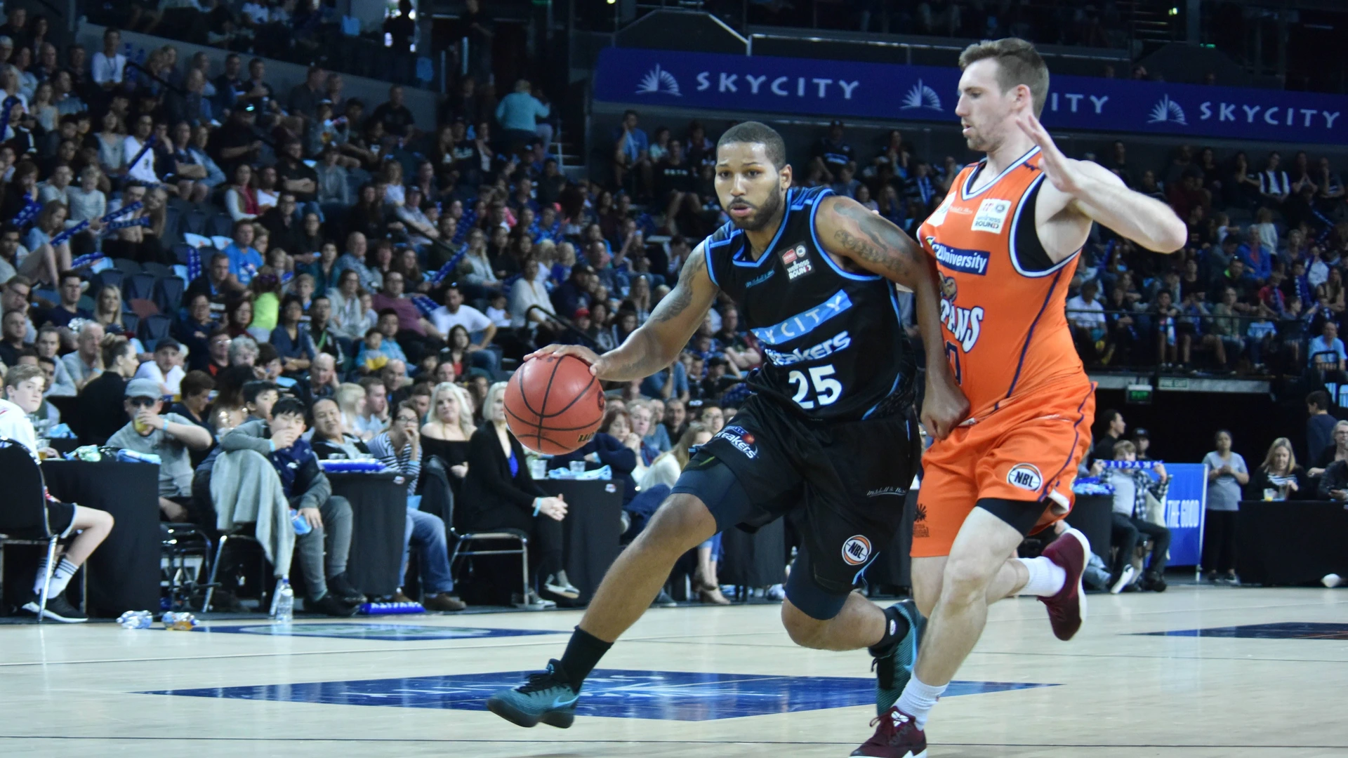 New Zealand v Australia Cairns Taipans basketball DJ Newbill (L) of New Zealand Breaker is in action during the round one NBL match between the New Zealand Breakers and the Cairns Taipans at Spark Arena on October 8, 2017