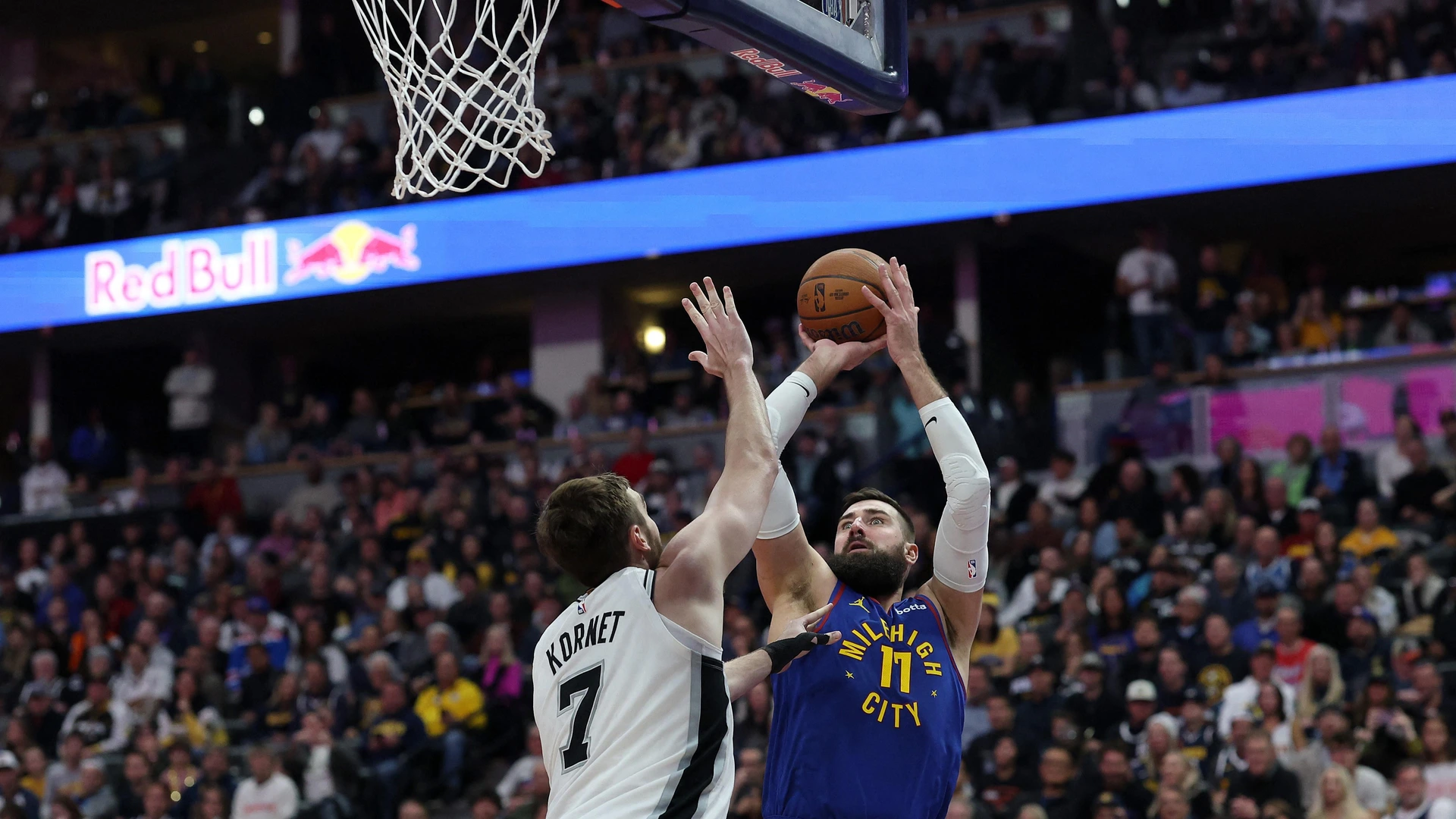 DENVER, COLORADO - NOVEMBER 28: Jonas Valanciunas #17 of the Denver Nuggets puts up a shot over Luke Kornet #7 of the San Antonio Spurs in the fourth quarter at Ball Arena on November 28, 2025 in Denver, Colorado.