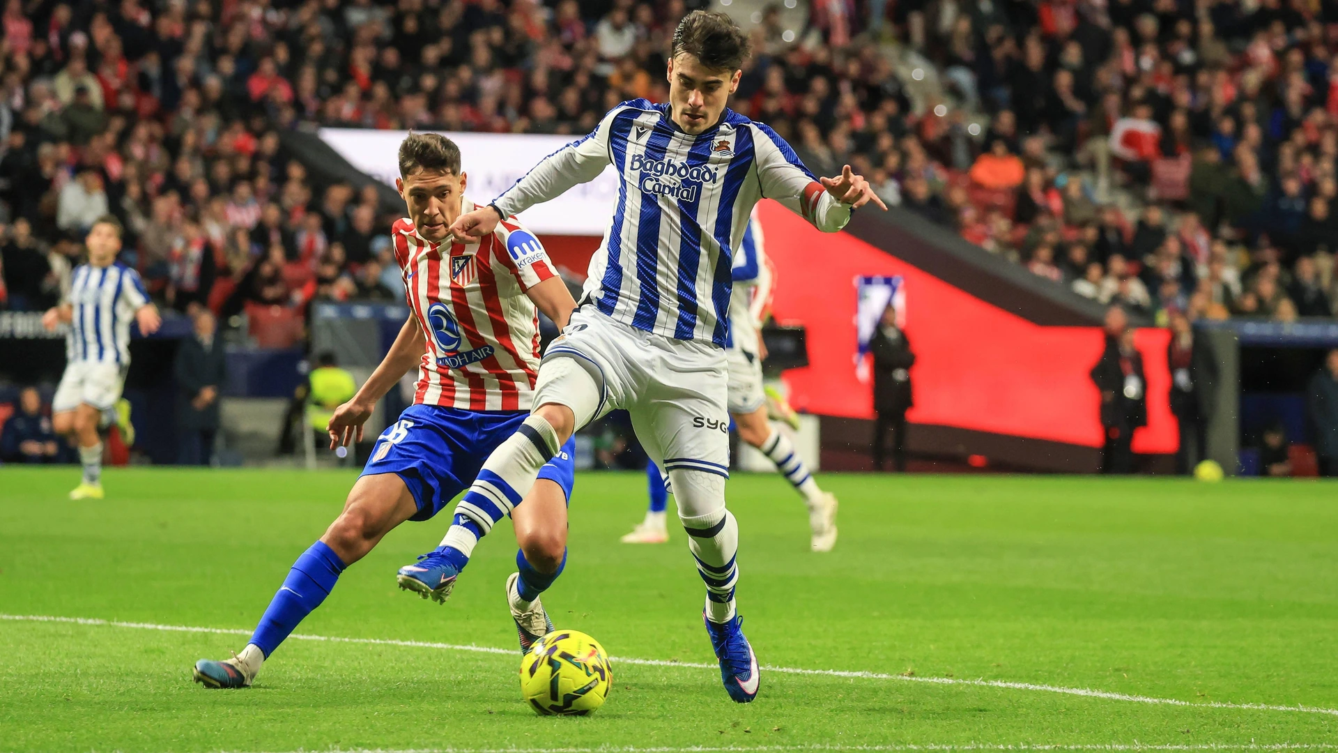 Ander Barrenetxea of Real Sociedad controls the ball under pressure from Nahuel Molina of Atletico de Madrid during the LaLiga EA Sports football match between Atletico de Madrid and Real Sociedad at Estadio Riyadh Air Metropolitano on March 07, 2026