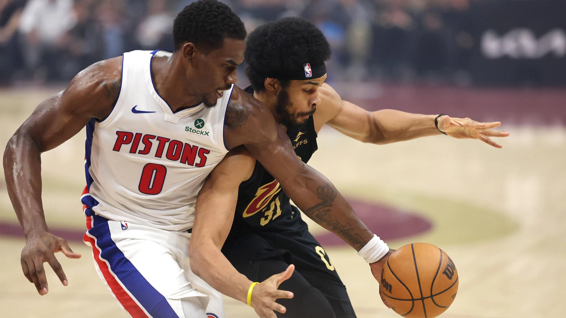 Detroit Piston s Jalen Duren 0 reaches over Cleveland Cavalier s Jarrett Allen 31 for a loose ball during the third quarter in Cleveland, Ohio Tuesday March 3, 2026. The Cavaliers defeated the Pistons 113-109.
